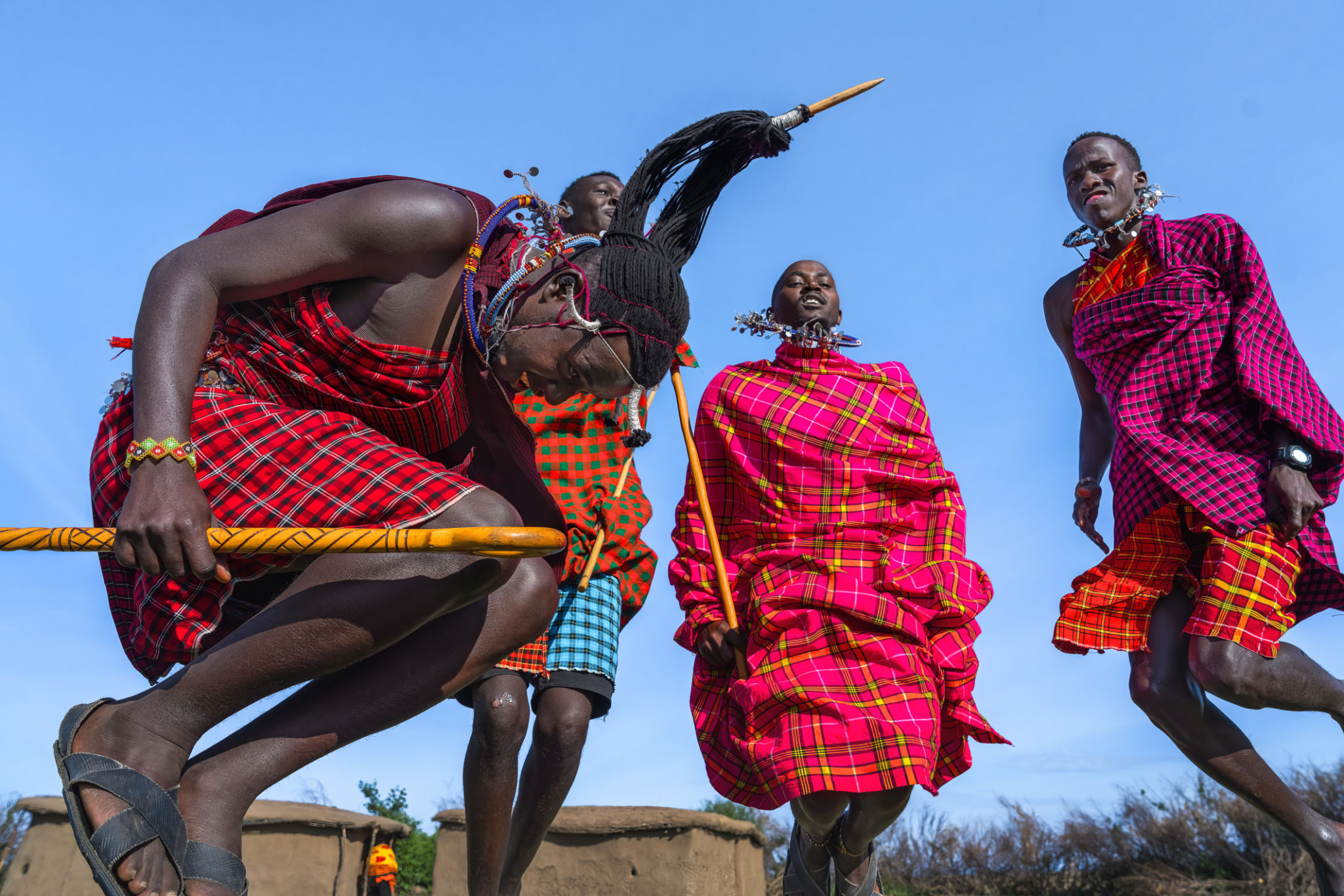 Maasai Mara man showing traditional Maasai jumping dance Maasai Mara man showing traditional Maasai jumping dance